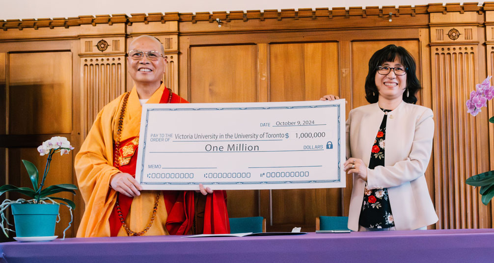 The Venerable Dayi Shi presented Emmanuel College Principal HyeRan Kim-Cragg with a cheque for the first $1 million of a $3 million commitment at a reception.