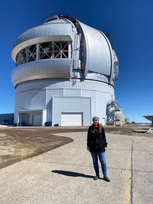 Emily standing in front of the Gemini Observatory in Chile.