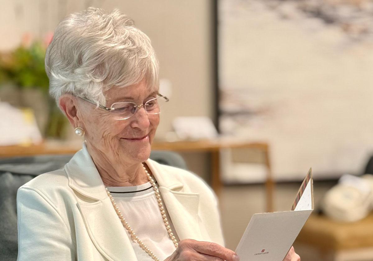 Florence Newman reading a birthday card.