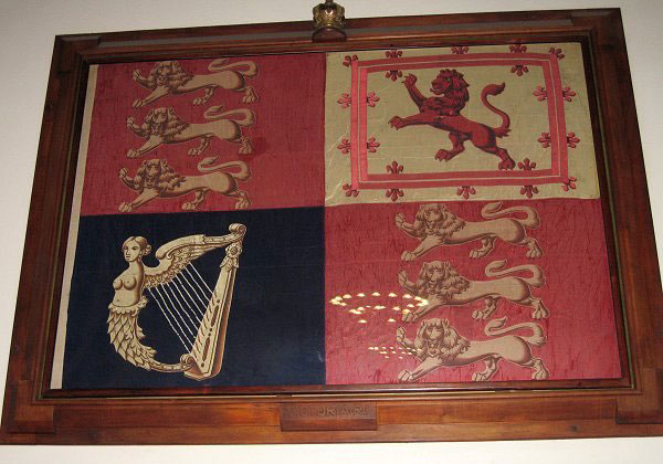 Hanging over High Table on the west wall of Burwash Dining Hall is a four-sectioned flag framed in walnut.